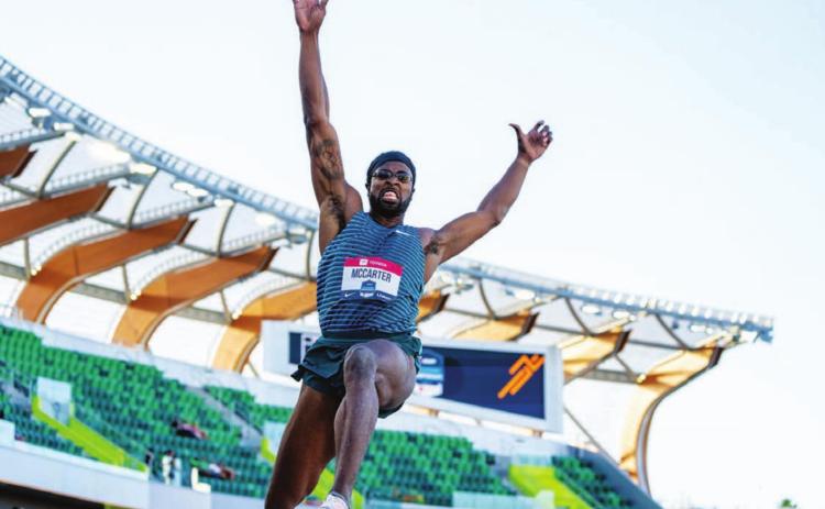Steffin McCarter leaps through the air during the world championship qualifiers event last week. COURTESY PHOTO | TEXAS ATHLETICS