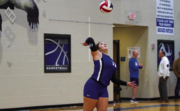 Julia Ybarra swings through a serve during a recent match at home. HUNTER KING | DISPATCH RECORD
