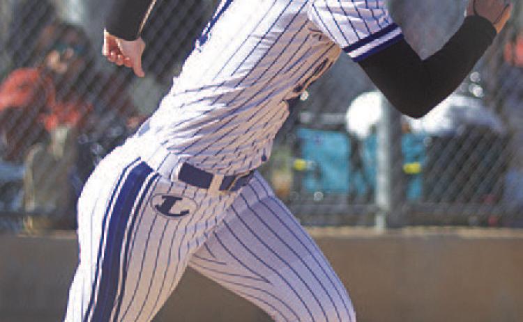 Bre Quarles sprints out of the box after laying down a sacrifice bunt. HUNTER KING | DISPATCH RECORD