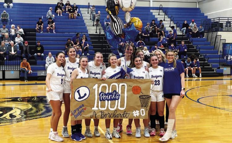 The girls’ basketball team celebrated Addison Borchardt reaching 1,000 career points ahead of a home game last week. HUNTER KING | DISPATCH RECORD