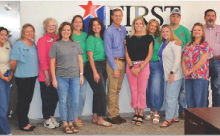 First Texas Bank has continued its support of the Spring Ho Festival by making a contribution toward the signature, weeklong event that commences next week in Lampasas. Shown here, from left to right, are several Spring Ho Committee members with bank employees Blanca Rathbun, Jennifer Wiley, Ladonna Bishop, Brittany Whitcomb, Megan Tabor, Stacy Oncken, Kelvin Barkowsky, Annie Trotter, Shane Wilson, Torie Palmer, Nick Myers, Taylor Payne and Lee Loeffler. hunter king | dispatch record