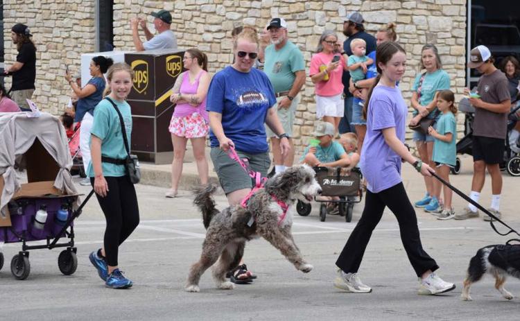 The promenade of pets includes all types of friendly animals. Pets and their owners are encouraged to wear a costume in conjunction with the festival theme. FILE PHOTO
