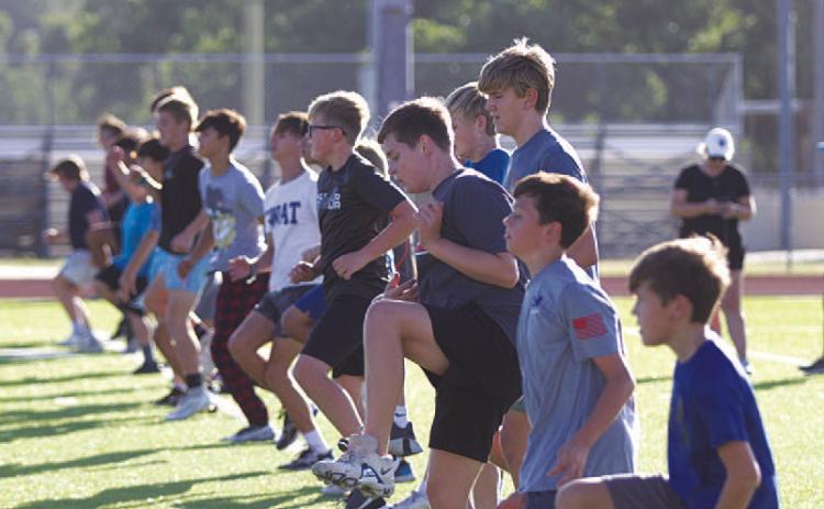HUNTER KING | DISPATCH RECORD Young Badgers put in work on the high school football field last week.