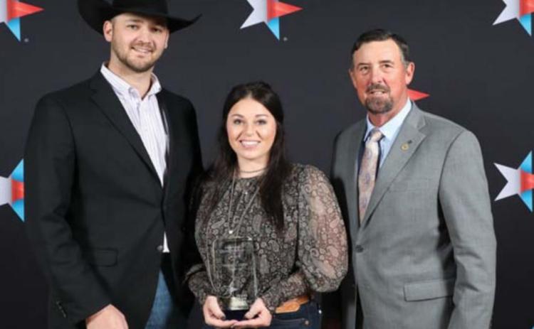 Heston and Stevie McBride were recipients of the Excellence in Agriculture award at the 88 th annual Texas Farm Bureau convention. They are shown here with TFB President Russell Boening, at right. COURTESY PHOTO | TEXAS FARM BUREAU MEDIA CENTER