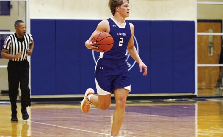 Haegan Oncken dribbles up the floor during the Badgers’ game against Jarrell. HUNTER KING | DISPATCH RECORD
