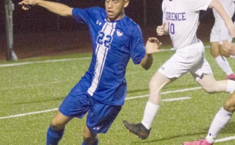 Cruz Lucio (22) moves the ball against the Florence defense. JEFF LOWE | DISPATCH RECORD