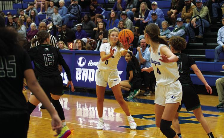 Addison Borchardt fires a pass to Lainey Dixon during last Friday’s game against Taylor. HUNTER KING | DISPATCH RECORD
