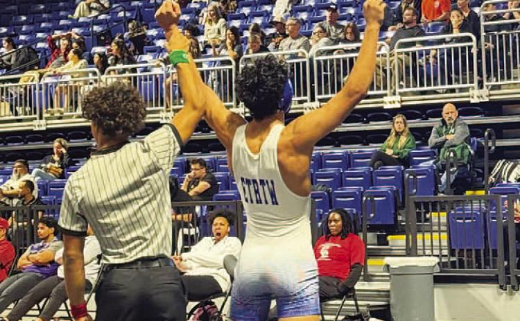 Kaiden Fernandez has his hand raised in victory during the Cy-Fair tournament. COURTESY PHOTO