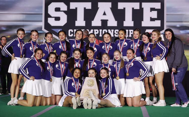 The cheer team poses with their trophy and medals after finishing third at the state competition in Fort Worth. COURTESY PHOTO