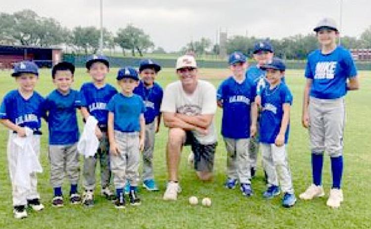 Youth baseball players train under elite 5A coach