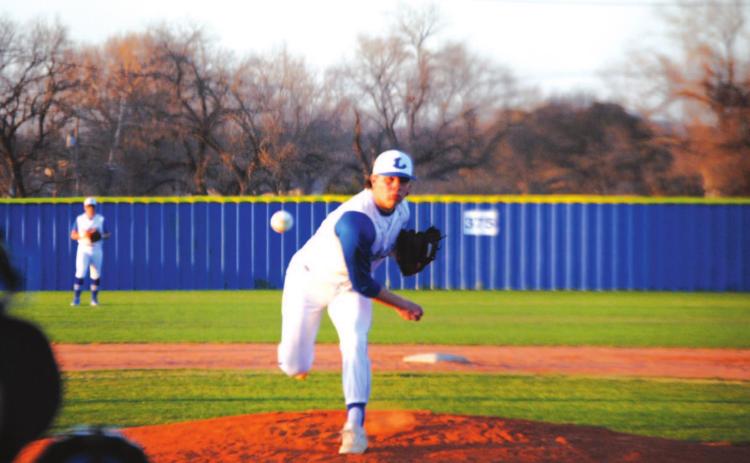 Tak Stinnett tosses a pitch on his way to completing seven full innings to beat Brownwood on Tuesday night. HUNTER KING | DISPATCH RECORD
