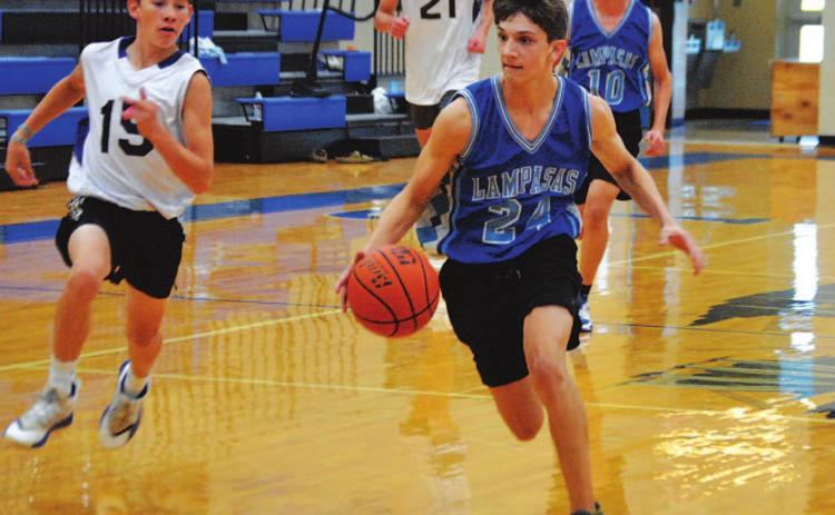 Luke Shivers dribbles to the basket for a layup during the Badgers’ first summer game against San Saba. HUNTER KING | DISPATCH RECORD