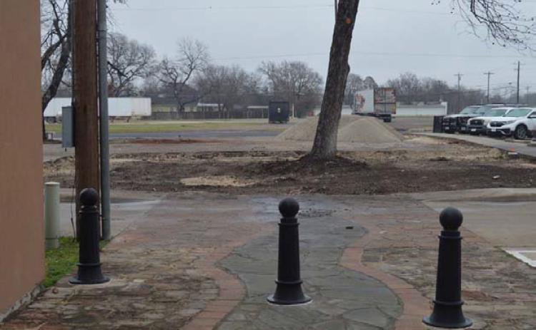 An empty space can be seen behind the Lampasas County Office Buildings, the former site of the pocket park. A future county-owned storage building will soon fill the space. ERICK MITCHELL | DISPATCH RECORD