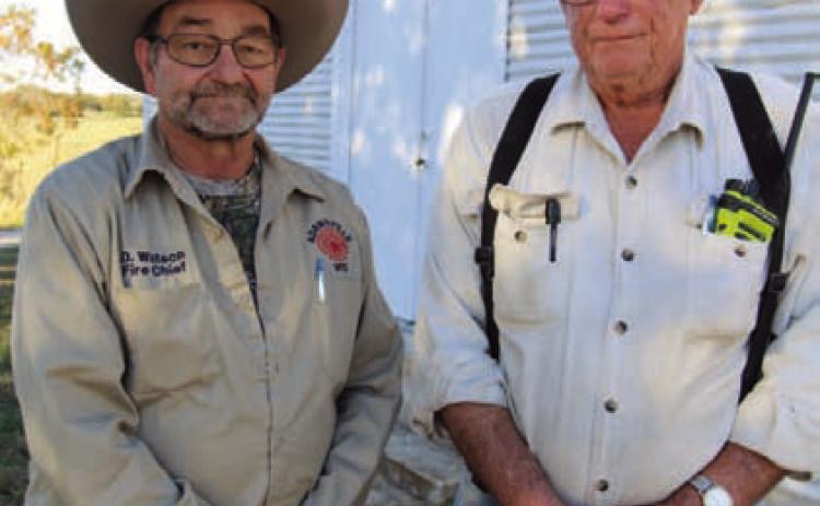 Adamsville Volunteer Fire Chief Dean Watson and Larry Straley, left to right, pose for a photo at the 55th Annual Deer Hunter’s Bar-B-Que on Saturday. JOYCESARAH MCCABE | DISPATCH RECORD