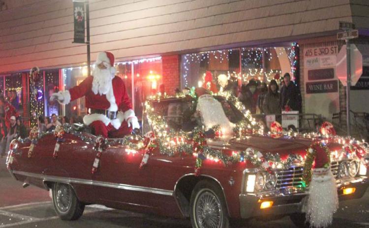 Santa is expected to ride in style for this year’s Holidazzle Lighted Christmas Parade, as he did in previous parades through downtown Lampasas. The jolly old man will be available Saturday from 3-4 p.m. at the Ajinomoto Foods lobby, 601 E. Third St., for photos before he joins the parade later in the evening. FILE PHOTO