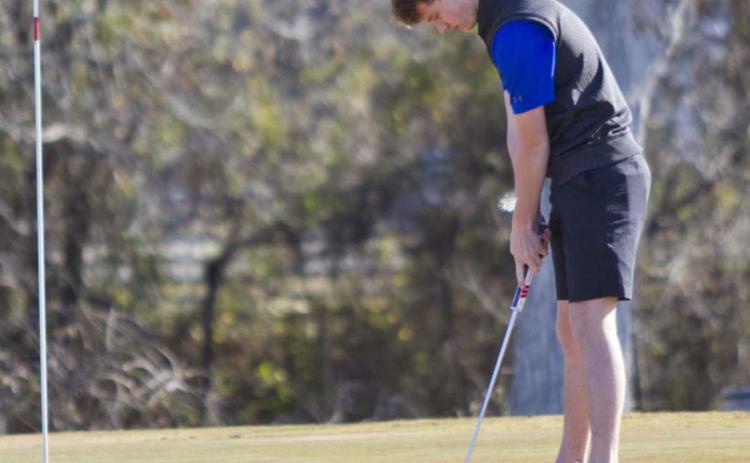 Aiden Wiley putts on Hole No. 1 at Hancock Park Golf Course on Monday. JEFF LOWE | DISPATCH RECORD