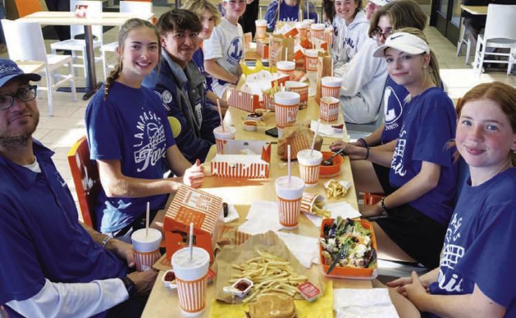 COURTESY PHOTO | KENNETH PEISER The Lampasas tennis team enjoys a meal at Whataburger after a successful trip to Burnet.