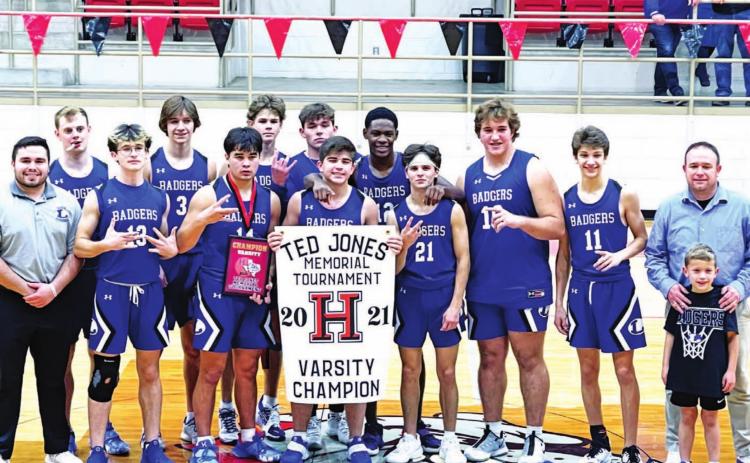 The Badgers pose with their trophy and banner as champions of the Hamilton varsity tournament. COURTESY PHOTO