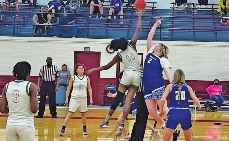 Morgan Lovejoy goes up for the opening tip during a game in the Edgewood tournament over the weekend. Also pictured is Cobie Chandler. COURTESY PHOTO