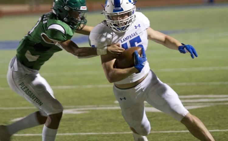 Case Brister attempts to make a defender miss while running down the sideline in the Badgers’ first-round playoff game against Pleasanton last Friday. HUNTER KING | DISPATCH RECORD