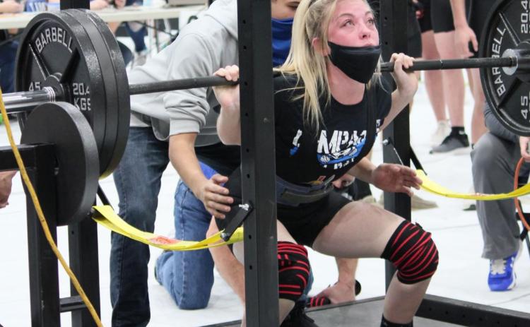 Three-time state qualifier Alyssa Ayers squats in the powerlifting season opener in Lampasas. CHRIS YBARRA | DISPATCH RECORD