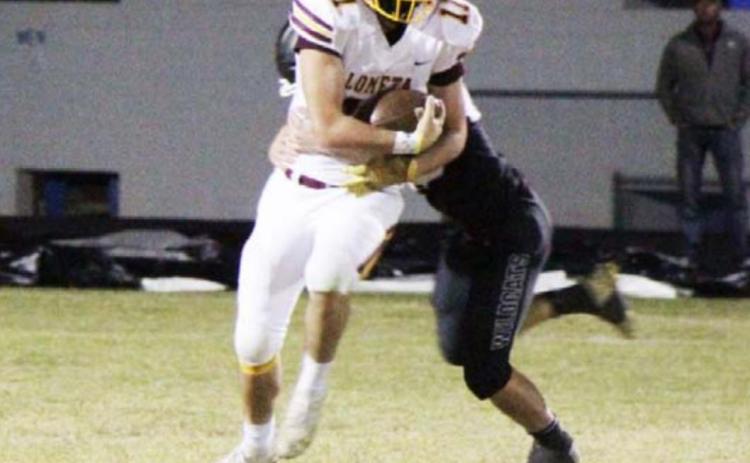 D.J. Smart attempts to break the tackle attempt of a Water Valley defender during the final game of the season. JESSICA MALDONADO | DISPATCH RECORD