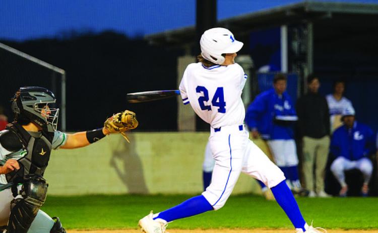 Timber Gholson connects on one of his hits during Tuesday night’s game against Burnet. HUNTER KING | DISPATCH RECORD