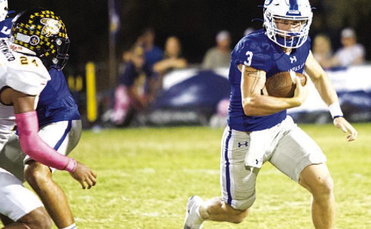 Reed Jerome runs away from a Stephenville defender during last Friday’s district contest. The quarterback continues to lead the Badgers this season. HUNTER KING | DISPATCH RECORD