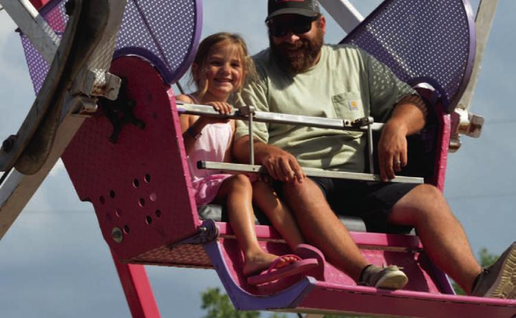 Rides like the ferris wheel bring a bit of nostalgia to the Spring Ho Festival. FILE PHOTO