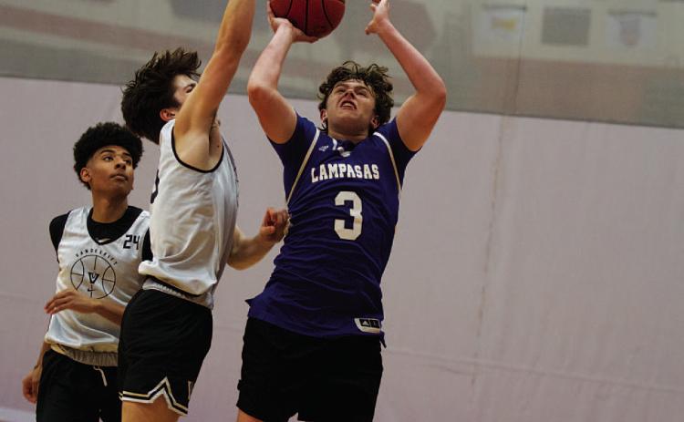 HUNTER KING | DISPATCH RECORD Aidan Nuckles shoots a contested shot over a Vandergrift defender during Wednesday’s action.