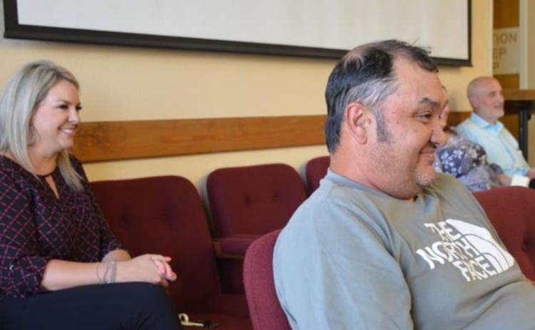 School board candidates Kelsi Davis and Harvey Stinnett listen to school officials explain their election options during a May 19 special school board meeting, after the May 7 trustee election ended in a tie. MONIQUE BRAND | DISPATCH RECORD