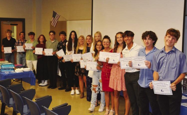 COURTESY PHOTO | KENNETH PEISER Badger tennis players show off their certificates from this week’s banquet.