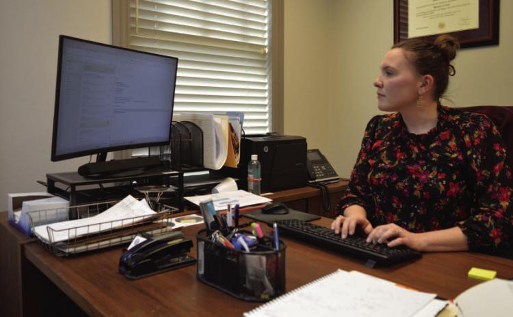 County Attorney Jessica Guy works from her desk at the Lampasas County Office Building. ERICK MITCHELL | DISPATCH RECORD