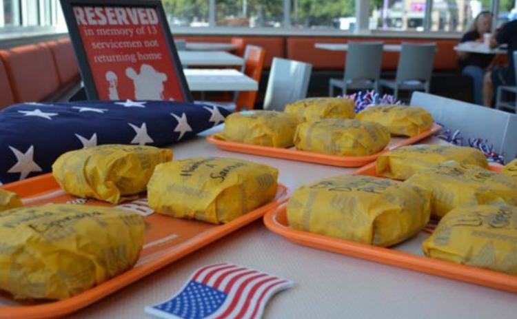 The 13 servicemembers killed in Afghanistan last week are honored inside the new Whataburger on Key Avenue. MONIQUE BRAND | DISPATCH RECORD