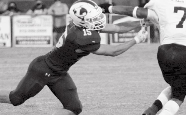 Case Brister reaches for a tackle in a Badger home game. JEFF LOWE | DISPATCH RECORD