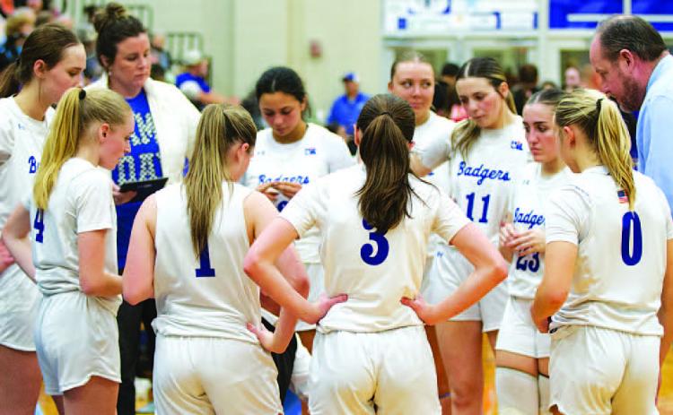 HUNTER KING | DISPATCH RECORD The Lady Badgers huddle around head coach Marcus Chapa during a timeout in the game against Jarrell on Tuesday.