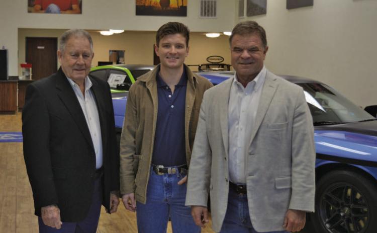 Three generations of the Benny Boyd family will celebrate the local car dealership’s 30th anniversary with a special barbecue for the public on Friday. Pictured here are Benny Boyd Sr., grandson Blaine Boyd and Benny Boyd Jr. ERICK MITCHELL | DISPATCH RECORD