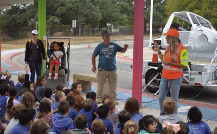 Lampasas County resident and child passenger safety technician Paul Miceli talks with Hanna Springs Elementary School students earlier this school year about the importance of car seat safety. COURTESY PHOTO