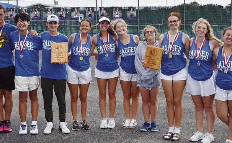 COURTESY PHOTO | KENNETH PEISER Junior varsity tennis poses with their plaques and medals from the district tournament.