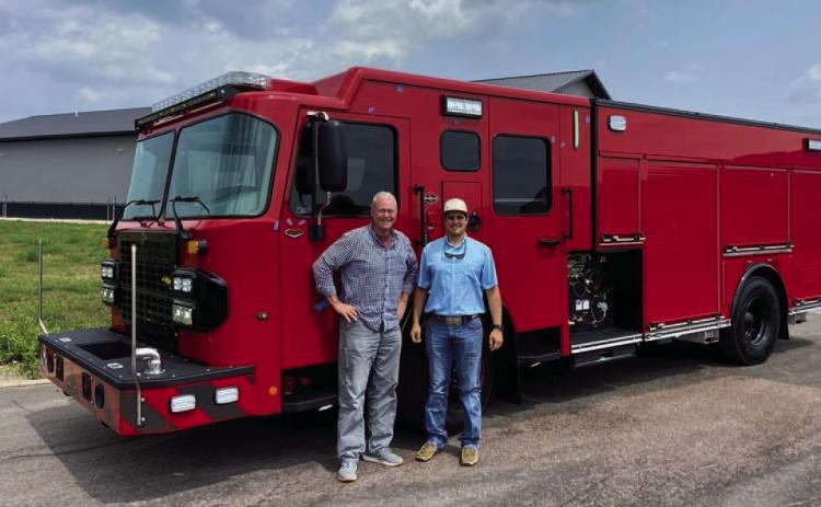 Former fire chief Jeff Smith and engineer Jared Payne stand in front of the Spartan NXT pumper after the truck completed its final inspection in South Dakota last August. The new addition for the Lampasas Fire Department is ready to be officially put into service. FILE PHOTO