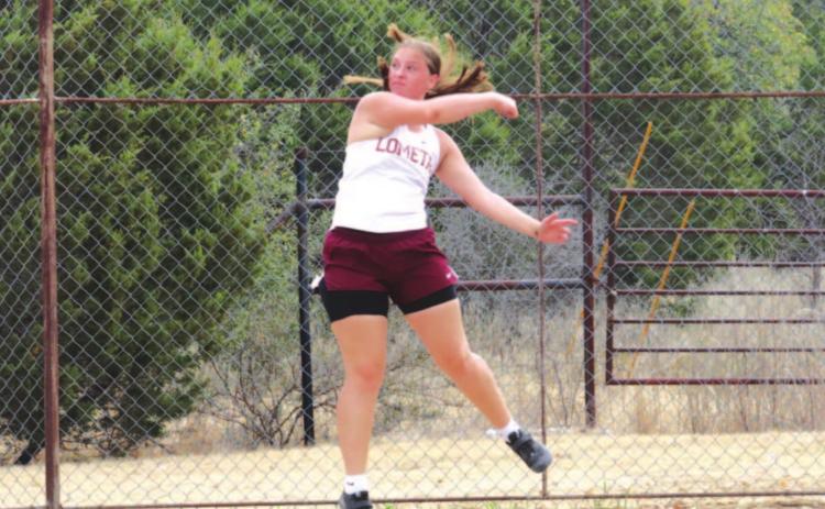Sierra Tower follows through on a discus throw during the district meet earlier this season. FILE PHOTO
