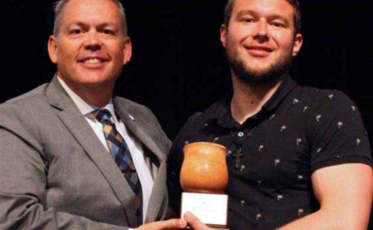 Howard Payne University President Dr. Cory Hines presents the Dr. Nat Tracy Servant Leader Award to Matthew Martin. COURTESY PHOTO