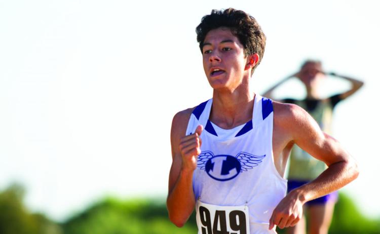 ANA SOFIA MEYER | DISPATCH RECORD Lampasas cross country runner Carlos Rodriquez pushes for the final 200 meters of the Class 4A District 24 race Oct. 14, finishing 12th, two spots shy of the regional qualifying cutoff.