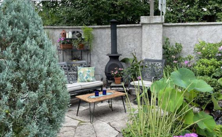 This patio is transformed into an outdoor oasis and entertainment area. COURTESY PHOTO | MELINDAMYERS.COM