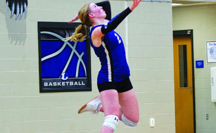 Ellie Felkner jumps to serve against Salado last Friday. HUNTER KING | DISPATCH RECORD