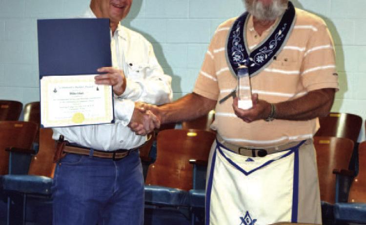 Mike Hail, at left, was presented the Community Builder Award by Saratoga Masonic Lodge. He is shown with Lodge Master Tommy Thogmartin. COURTESY PHOTO