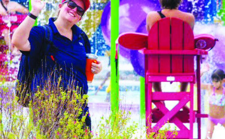 COURTESY PHOTO At left, Bailey Carter gives a wave to the camera during her time with Killeen’s Parks and Recreation Department. Now, Carter is looking to improve the Lampasas parks scene in her new role as recreation specialist for the city.
