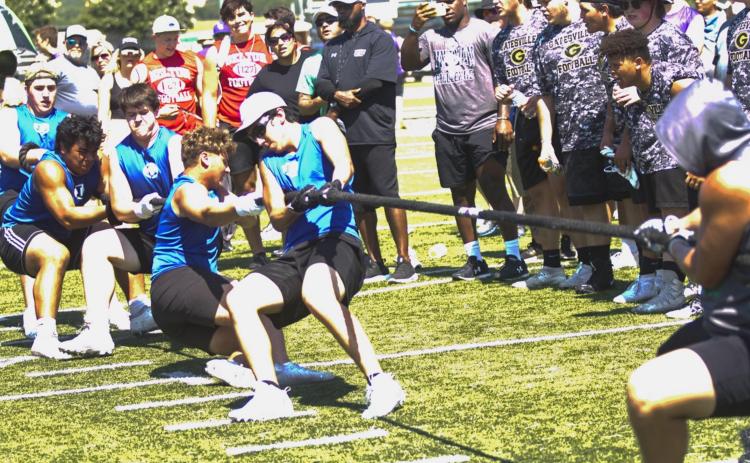 Badger football players compete in tug-of-war at a LIneman Challenge in Burnet on Friday on their way to winning the overall competition in Division II. Pictured, left to right, are Conner Keele, Sosa Sokimi, Michael Neary, Josh Carter and A.J. Torrez. Nick Torrez also competed and is shown in a separate group photo on page 6. JEFF LOWE | DISPATCH RECORD