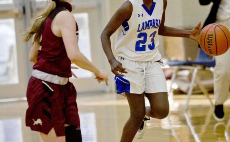 Nattie Martin drives down the court in the ninth-grade game. JEFF LOWE | DISPATCH RECORD