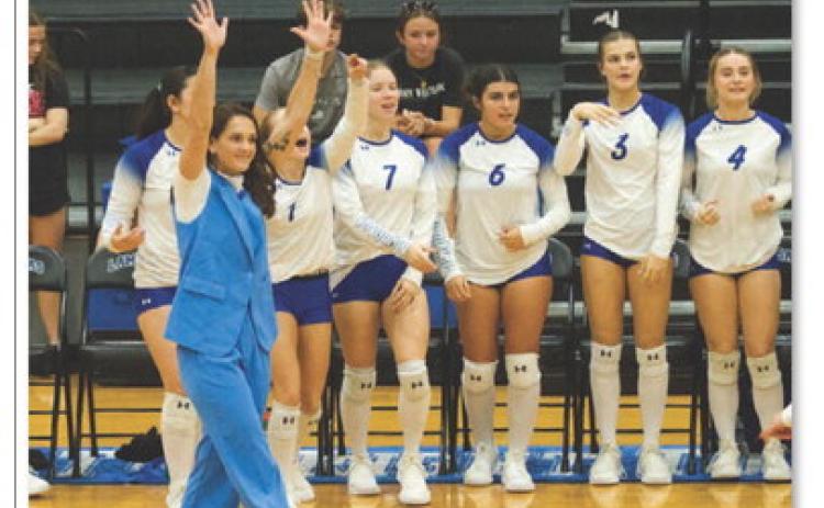 Lampasas volleyball coach Ali Tippie celebrates winning a long rally against Jarrell. The Lady Badgers beat Jarrell for the first time since ANA SOFIA MEYER | DISPATCH RECORD